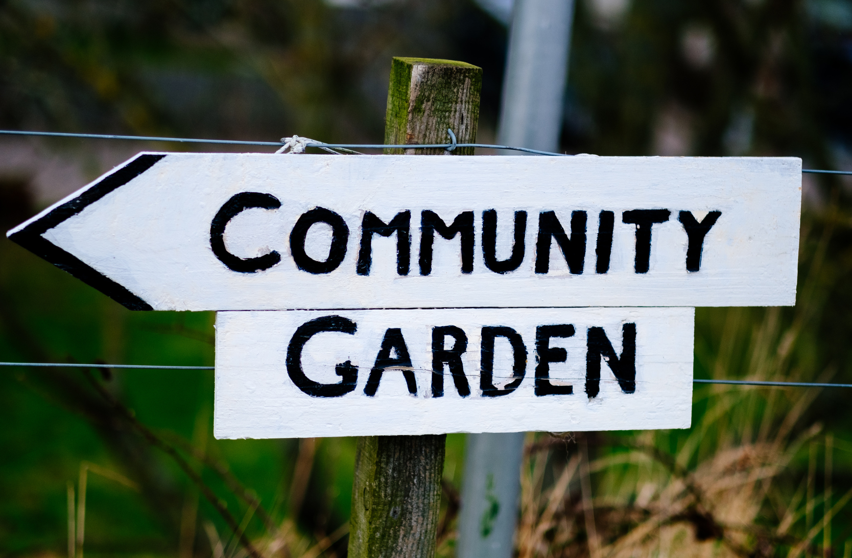 a sign that reads community garden