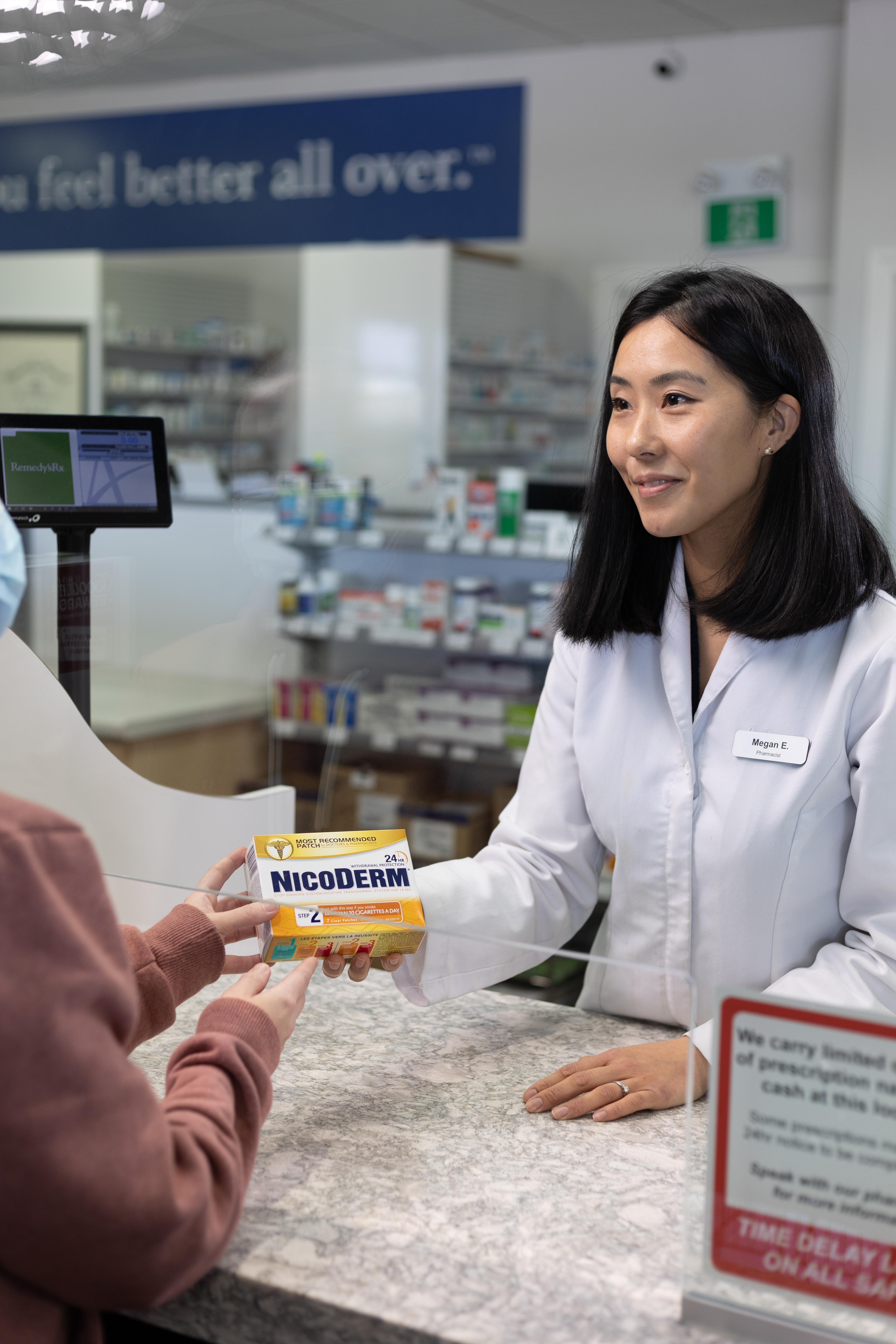 Pharmacist giving nicotine replacement therapy