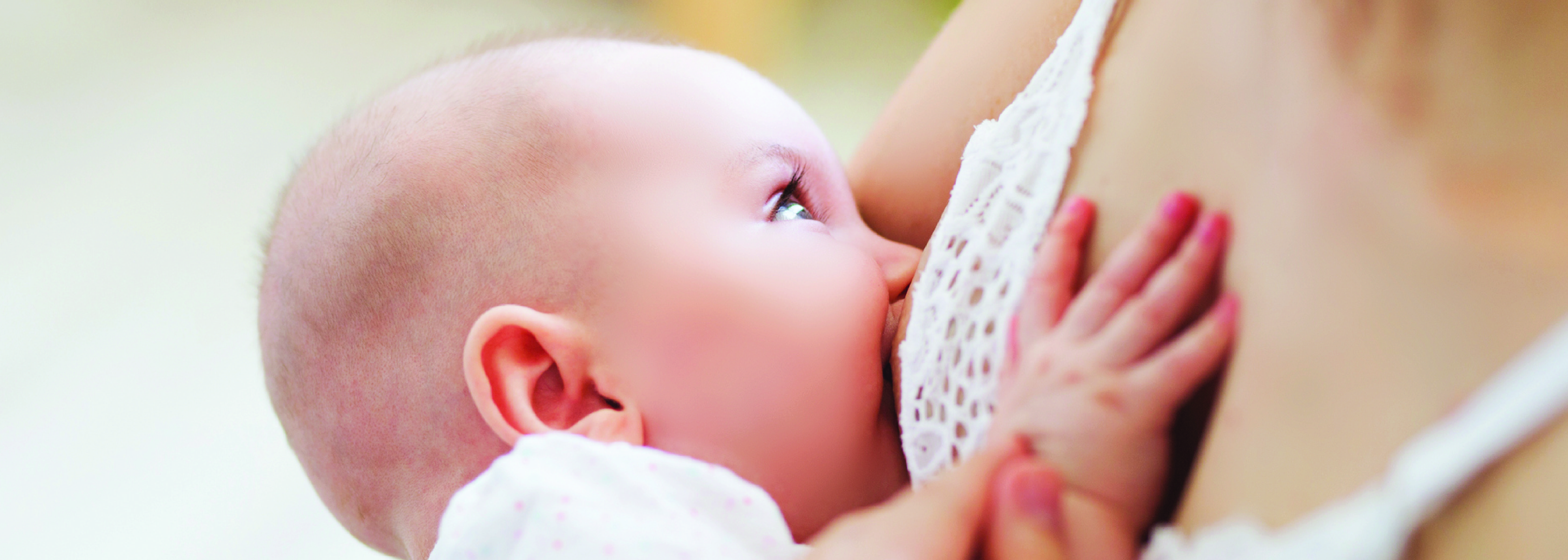 Baby breastfeeding on mother