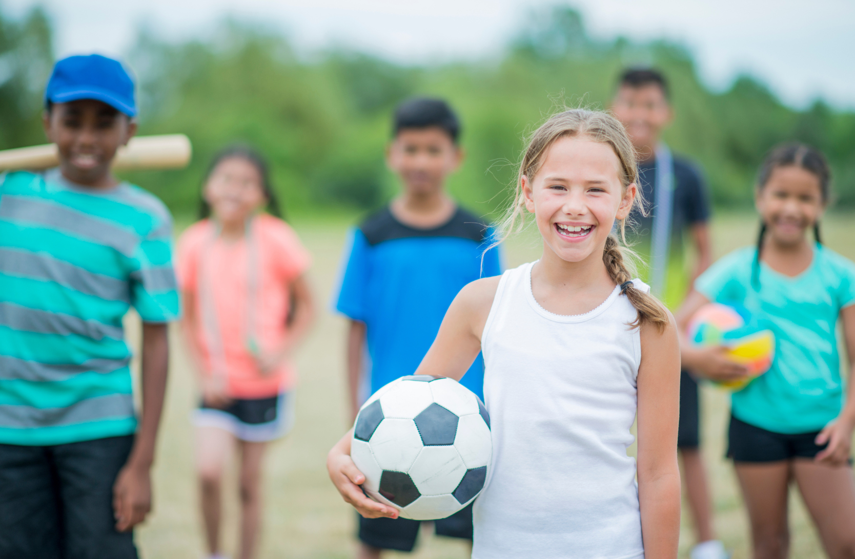 Girl holding a soccer ball