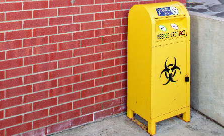 Yellow biohazard needle disposal bin